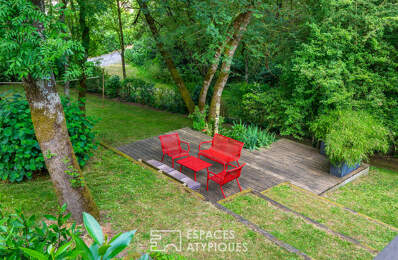 Maison et sa terrasse dans les arbres sur parcelle constructible — photo du bien