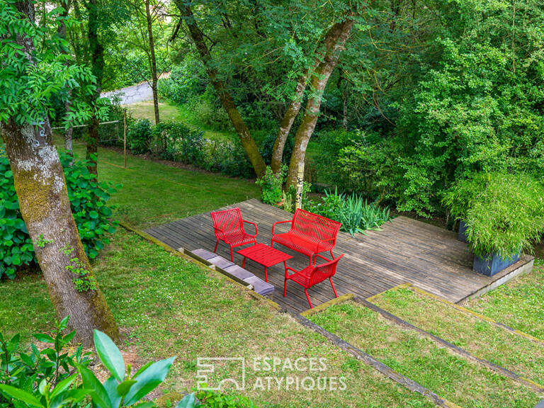 Maison et sa terrasse dans les arbres sur parcelle constructible — photo 1