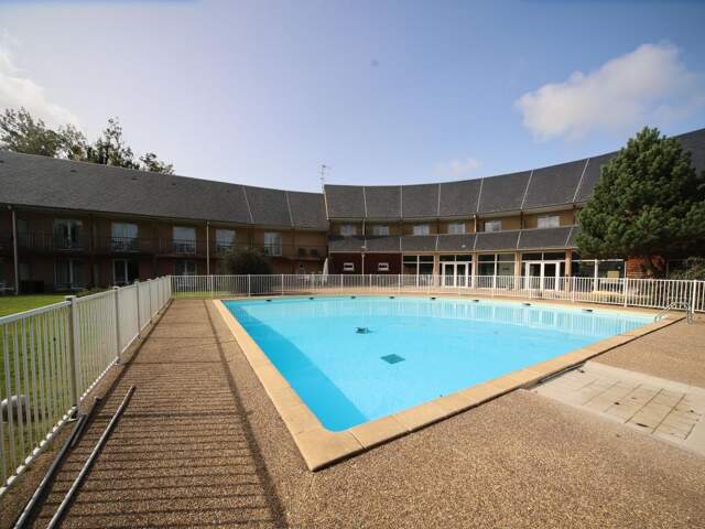 Studio dans résidence avec piscine — photo du bien