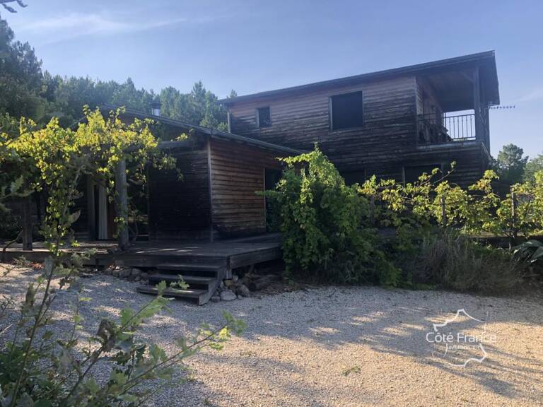 MAISON CONSTRUCTION EN BOIS SUR UN TERRAIN AVEC VUE DEGAGEE — photo 1