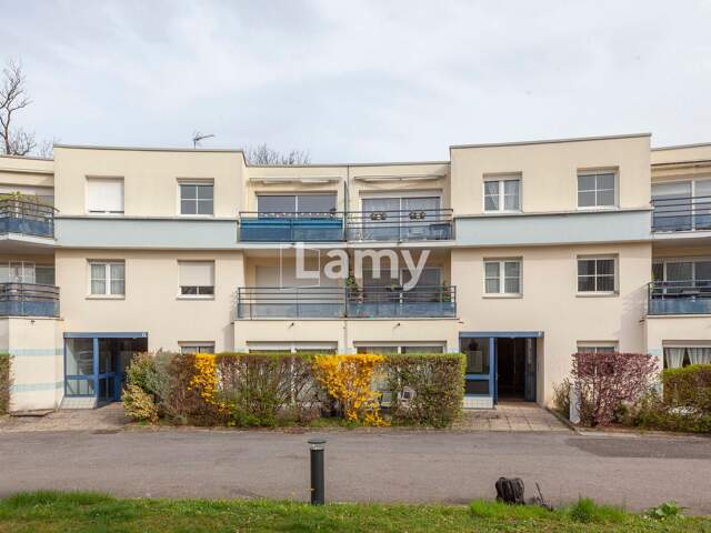 Appartement+ Stationnement + Cave  — photo du bien