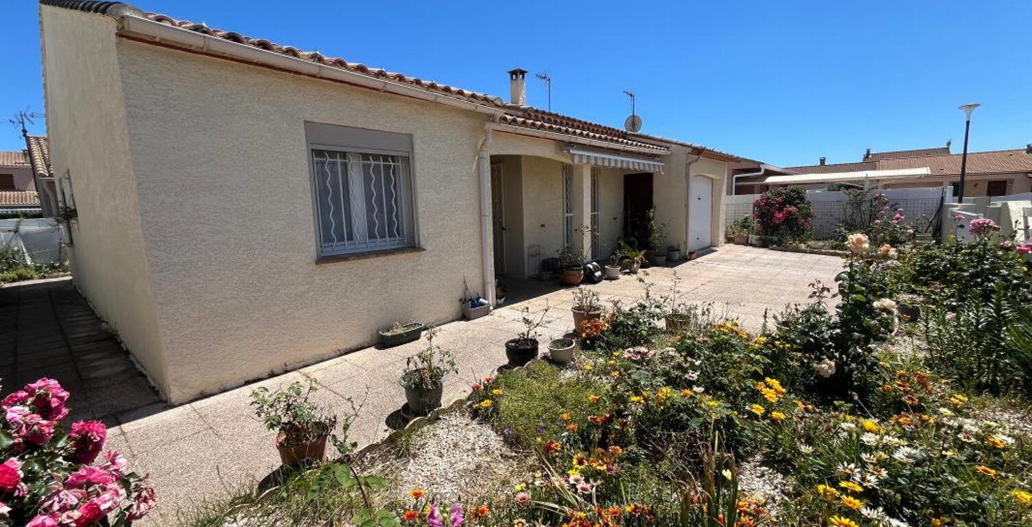 Maison de plain-pied en 4 faces avec garage — photo 1