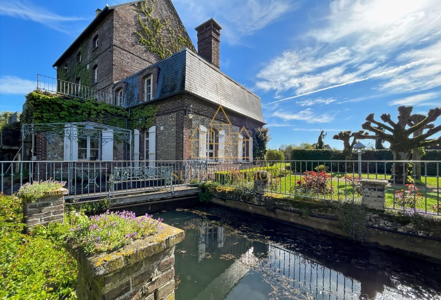 Propriété de prestige : ancien moulin de charme au cœur d’un écrin de verdure à 1h de Paris — photo 1