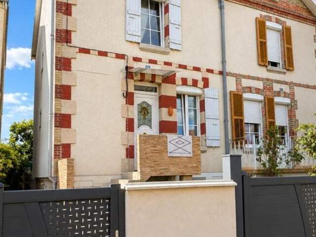 MAISON DE VILLE AVEC JARDIN — photo du bien