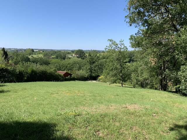 VENTE TERRAIN PUYGOUZON — photo du bien