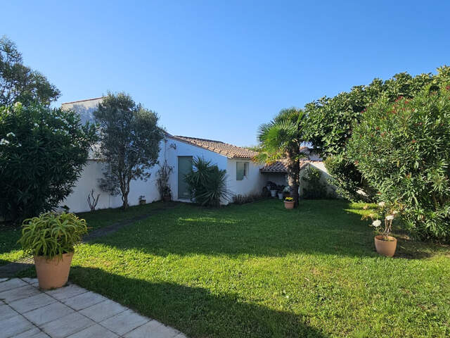 Maison de plain pied  sur jardin clos — photo du bien