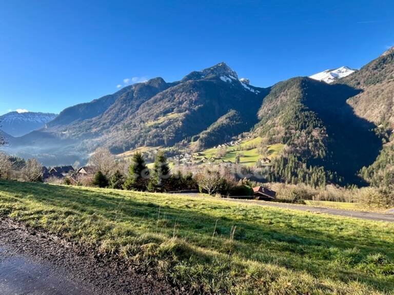 A vendre : Terrain d’Exception de 1530 m² – Vue Panoramique – Petit-Bornand-les-Glières (74) — photo 1