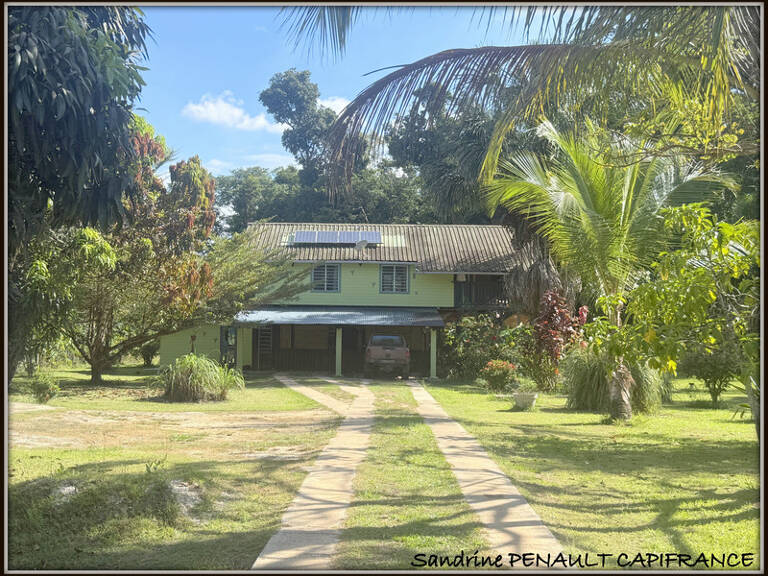A VENDRE A KOUROU UNE CHARMANTE MAISON T5 EN BOIS DE 133 m² SUPERFICIE TERRAIN 2 HECTARES - AU PRIX DE 346 500 € — photo 1