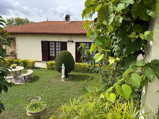 Maison T4 avec garage et jardin — photo du bien