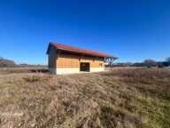 Vaste terrain constructible à vendre avec dépendance neuve — photo 3