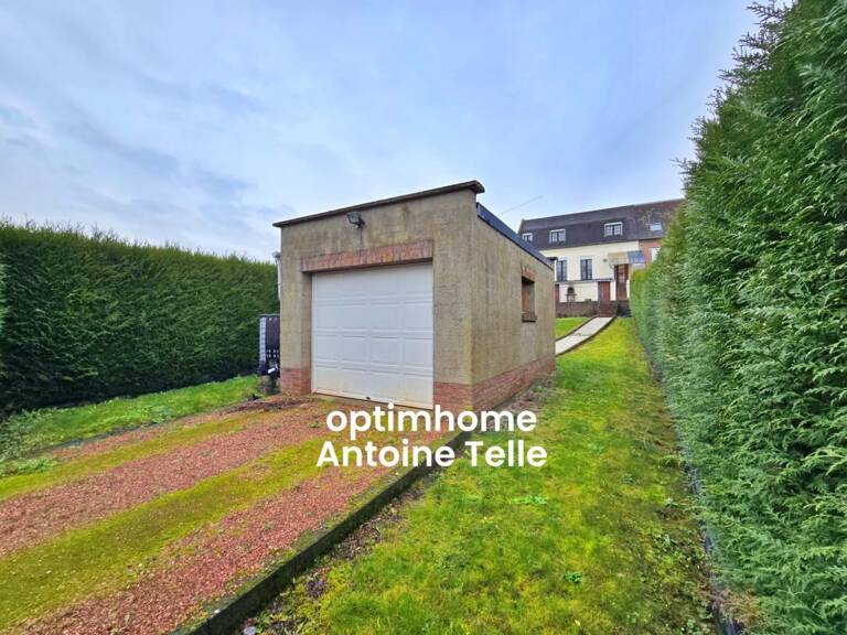 Le Cateau - Maison semi-individuelle à double accès avec garage, devanture & jardin clos sur 960m² — photo 1