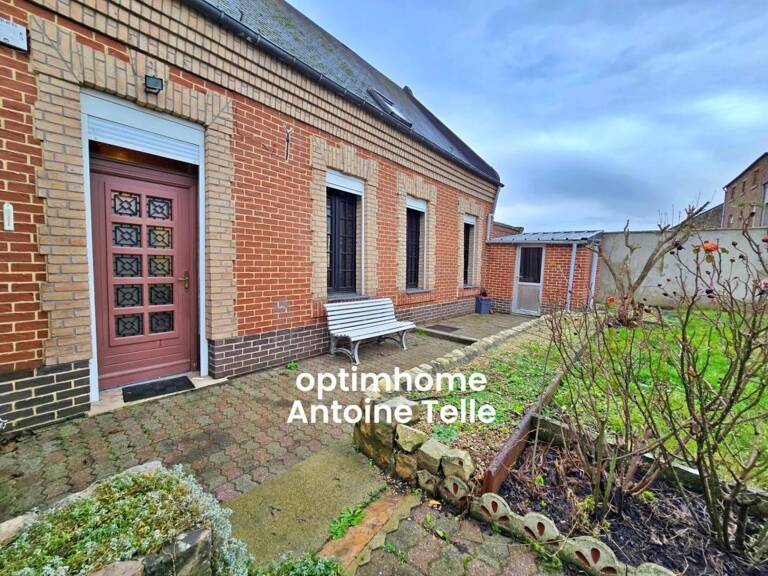 Le Cateau - Maison semi-individuelle à double accès avec garage, devanture & jardin clos sur 960m² — photo 1