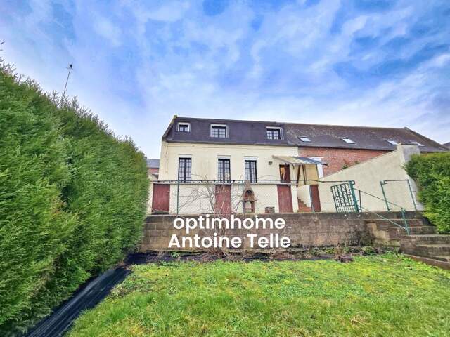 Le Cateau - Maison semi-individuelle à double accès avec garage, devanture & jardin clos sur 960m² — photo du bien