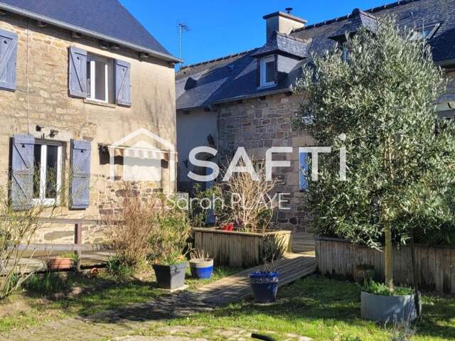 Propriété composée de deux maisons habitables, un garage, un atelier,  édifiée sur un terrain de 1240m2 — photo du bien