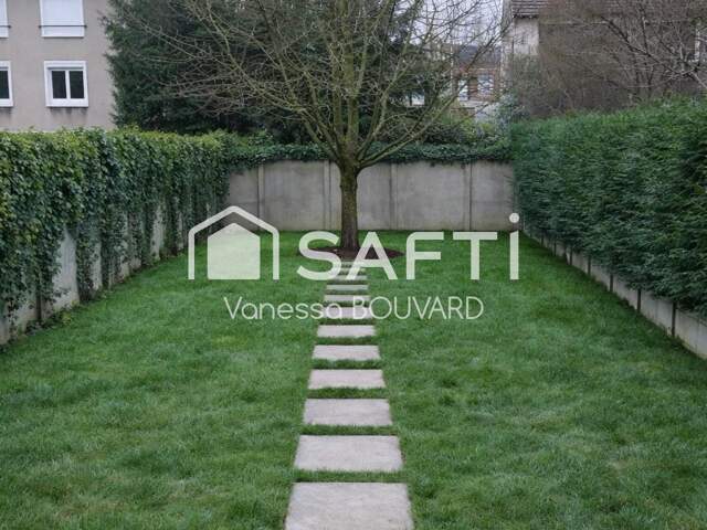 Maison mitoyenne rénovée avec jardin et sous-sol aménagé — photo du bien