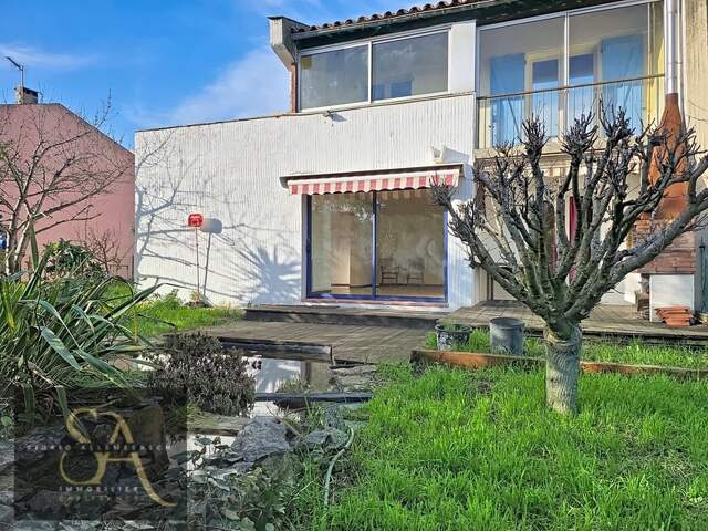 A vendre maison avec 3 chambres, un bureau, garage et jardin à Carcassonne proche des commodités — photo du bien