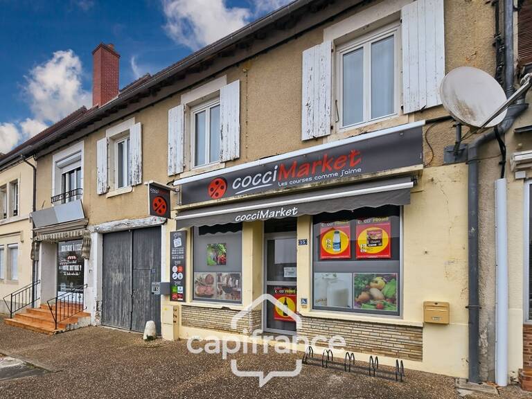 BOULLERET (18) – Immeuble de rapport avec commerces et logement loué — photo 1