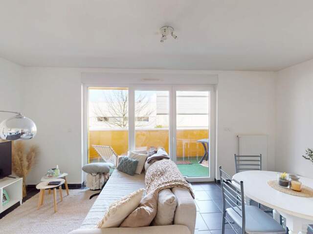 Manom : Appartement T2 de 47 m² vendu loué avec parking privatif — photo du bien