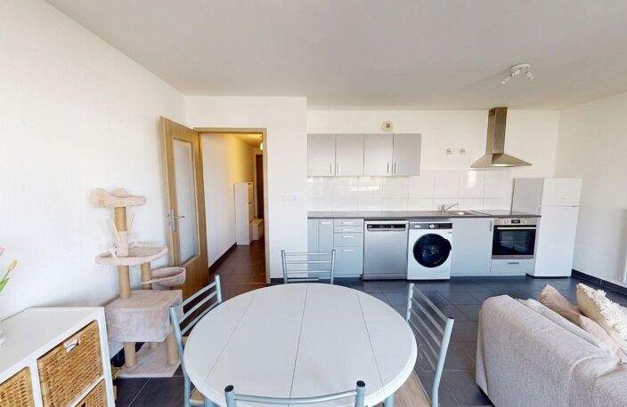 Manom : Appartement T2 de 47 m² vendu loué avec parking privatif — photo 4