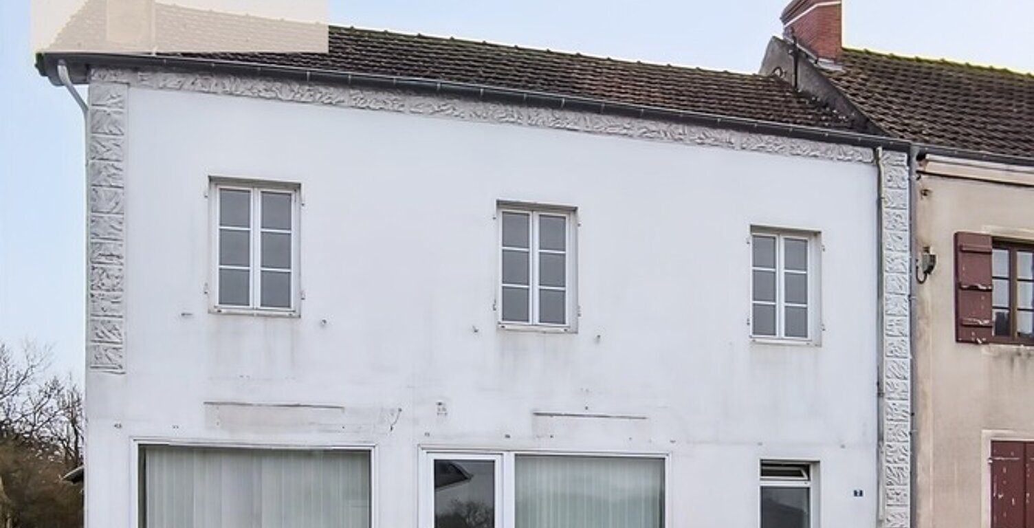 Immeuble  au cœur du bourg – Fort potentiel d’aménagement — photo 1