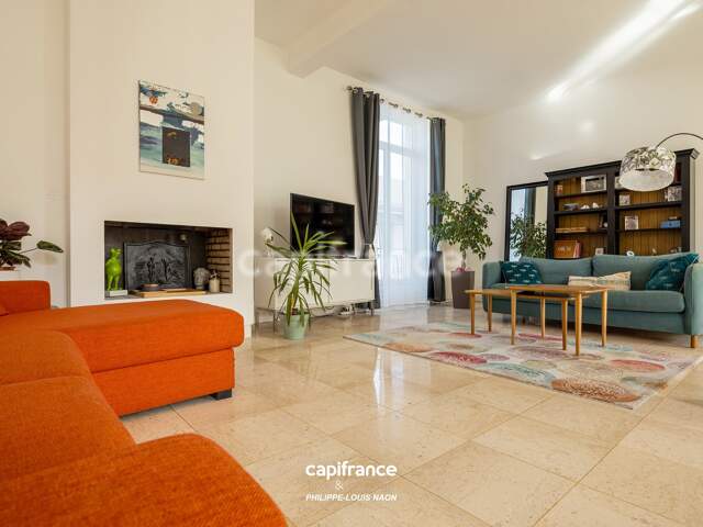 APPARTEMENT DE STYLE HAUSSMANNIEN D'EXCEPTION AVEC GRANDE PIÈCE À VIVRE DE PLUS DE 70M2 — photo du bien