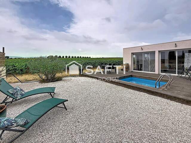 Villa moderne de plain-pied de 109 m² située à Adissan avec une piscine — photo du bien