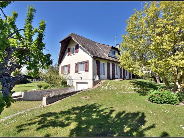 Maison familiale 4 chambres avec vie de plain-pied, sous-sol total et jardin de 1 380 m² — photo du bien