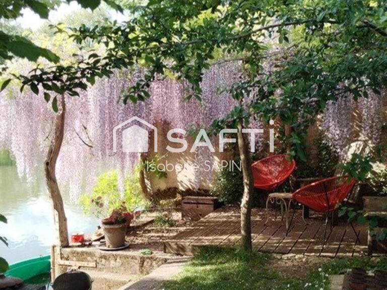 Un écrin de verdure atypique au bord de l'eau — photo 1