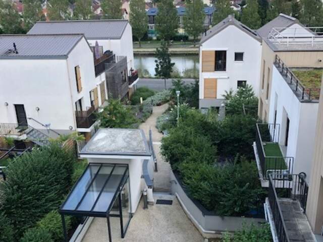 93320 – LES PAVILLONS-SOUS-BOIS – APPARTEMENT – 40 M² – 2 PIÈCES – BALCON – VUE CANAL – PARKING EN SUS – IMMEUBLE 2015 — photo du bien