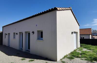 Loué - Immeuble de trois appartements de plain-pied + garages — photo du bien