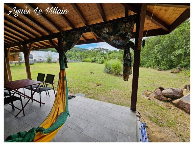 Terrain Plat avec petite maison proche Plage de Grande Anse — photo 1