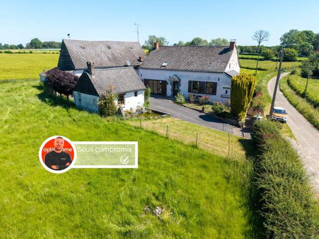Maison avec grange et fort potentiel dans un environnement calme avec 3 000m² de terrain — photo du bien