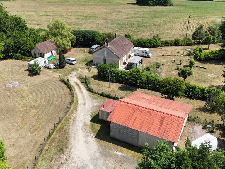 MAISON DE PLAIN-PIED 2 CHAMBRES + GARAGE + PETITE MAISON DE 40M² + GRAND GARAGE DE 120M², LE TOUT SUR UN TERRAIN DE 5 634M² ENVIRON CLOS.  — photo 1
