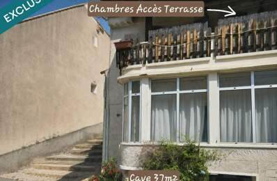 Maison de village avec terrasse, véranda, caves, garage et stationnement. — photo du bien