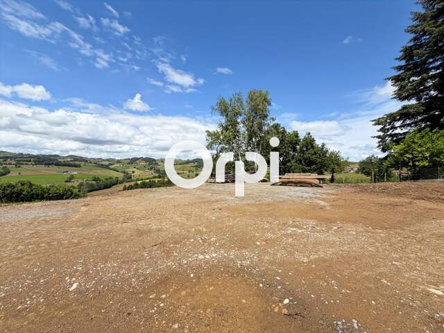 Terrain à bâtir de 472 m² viabilisé à Saint-Martin-en-Haut : Vue dégagée, exposition Sud-Ouest & libre constructeur ! — photo du bien