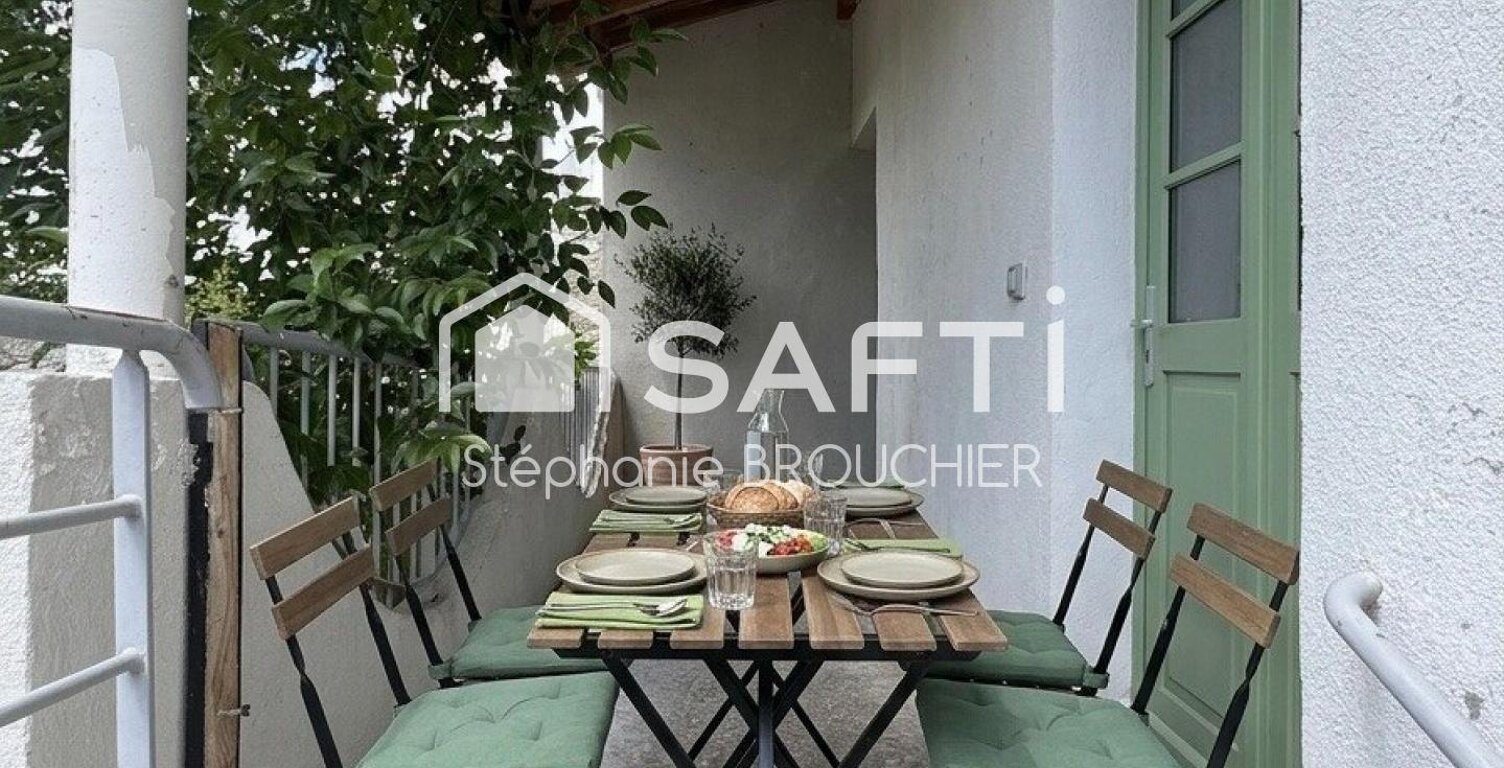 Appartement avec cave terrasse cour et local commercial — photo 1