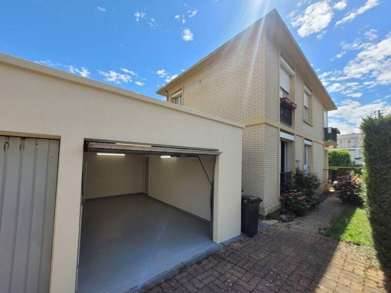 Appartement À Vendre en RDC surélevé sur terrain fermé avec balcon et garage exposé au sud — photo 1