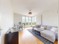 Appartement À Vendre en RDC surélevé sur terrain fermé avec balcon et garage exposé au sud — photo 4