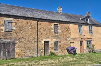 Ferme en pierre de 2 chambres avec grange attenante, à rénover et aménager entièrement, située sur un terrain rural de 1 175 m² à proximité de la ville de Mortain. — photo du bien