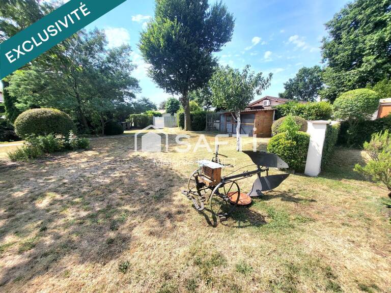 Maison plain-pied au calme avec grand jardin et beau potentiel — photo 1