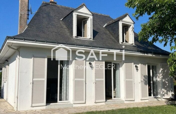 Maison familiale de 116 m² avec 4 chambres, sous-sol complet, terrain arboré de 1 077 m² et équipements énergétiques performants — photo 2