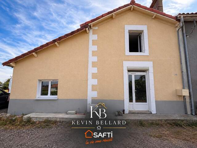 maison mitoyenne entièrement rénovée se composant de trois chambres dont une suite parentale ainsi qu'un grand séjour — photo du bien
