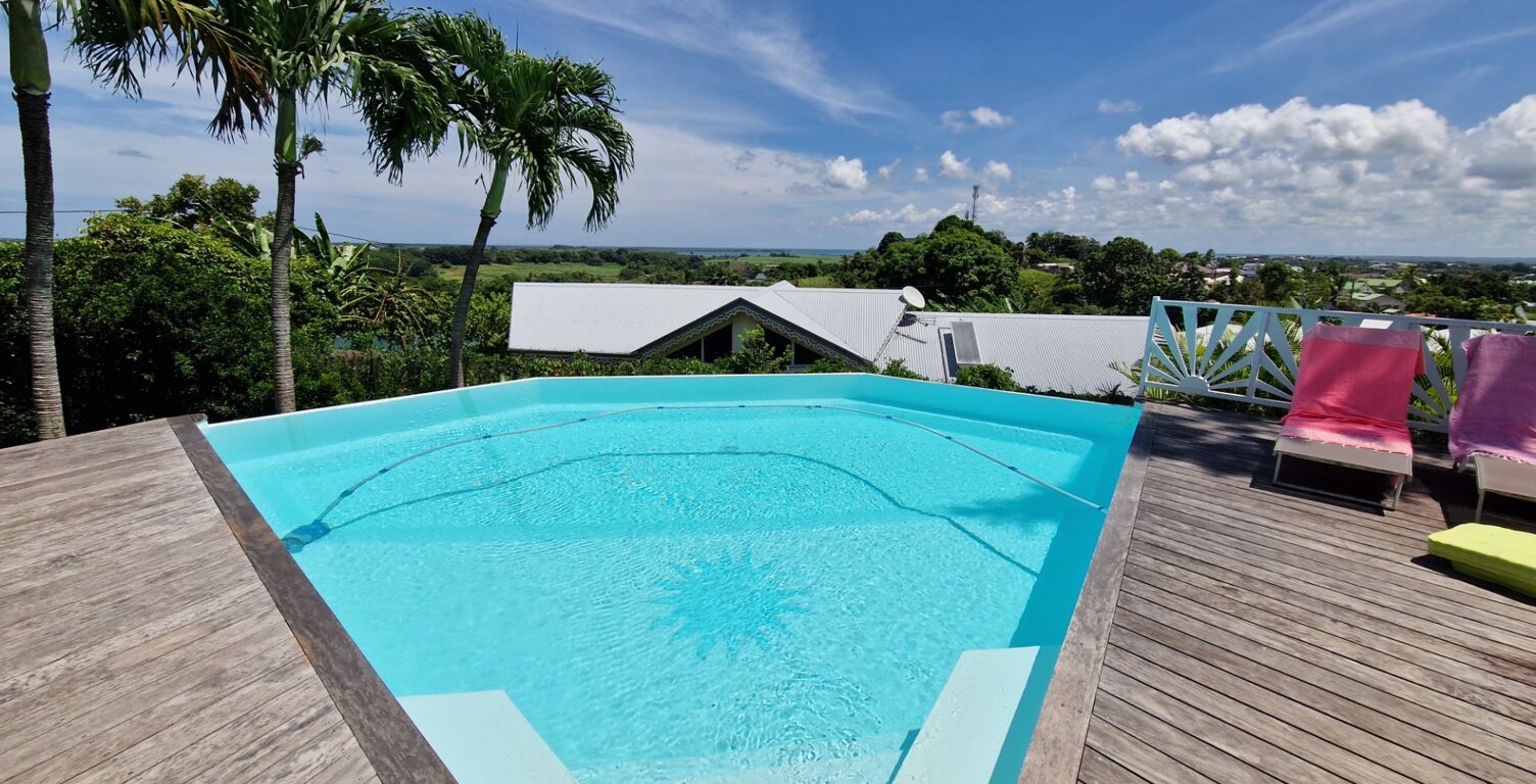 VUE MER Superbe villa de standing + T3 piscine à débordement sur 1000 m² à BAIE MAHAULT (971) — photo 1