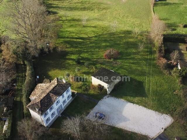 Maison 7 pièces 167m2 sur terrain de 1500 m2 en partie constructible — photo du bien