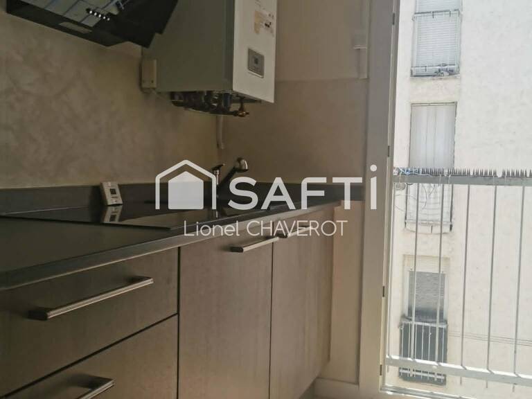 En plein cœur du centre-ville, découvrez cet appartement de 3 chambres avec garage. — photo 1