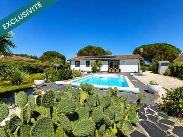 Maison de plain-pied  Piscine  Dépendance  Jardin paysager — photo du bien