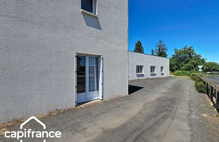 Local d’activité 260 m² + logement 132 m² – parking privé – terrain 1 690 m² – forte visibilité – Thouars (79100) — photo 3