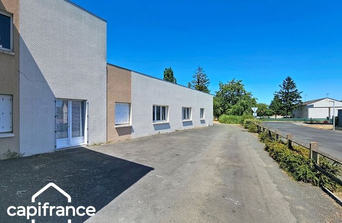 Local d’activité 260 m² + logement 132 m² – parking privé – terrain 1 690 m² – forte visibilité – Thouars (79100) — photo 4