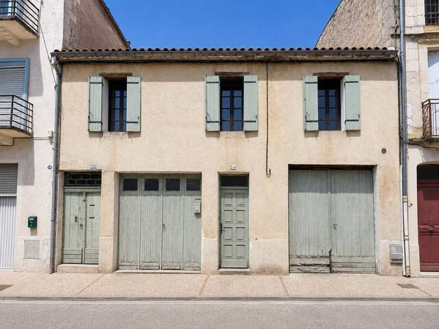 Maison de ville 90 m² – Grand séjour avec mezzanine – 2 chambres – Deux garages et cave – Centre de Sainte-Foy-la-Grande — photo du bien