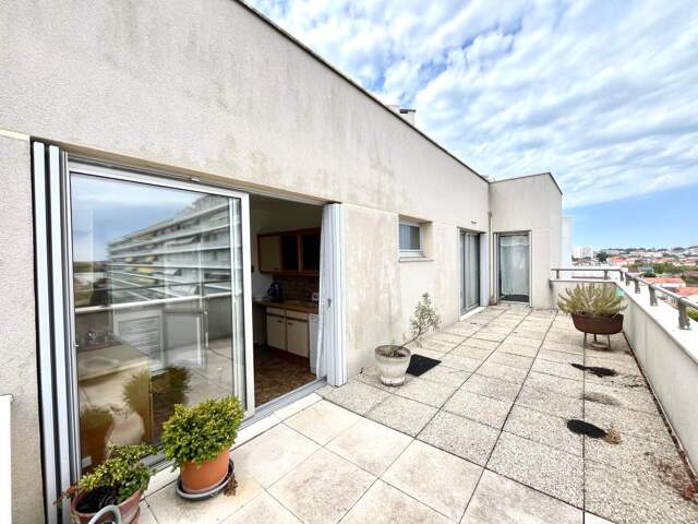 Bel appartement traversant et lumineux de 94 m² – 2 chambres, balcon, terrasse, box fermé et cave – dernier étage — photo du bien